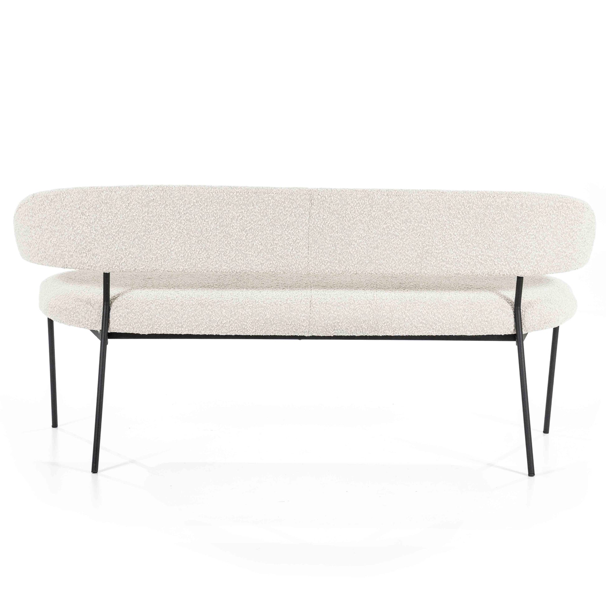 Spisebenk i lyst stoff med sorte metallben.